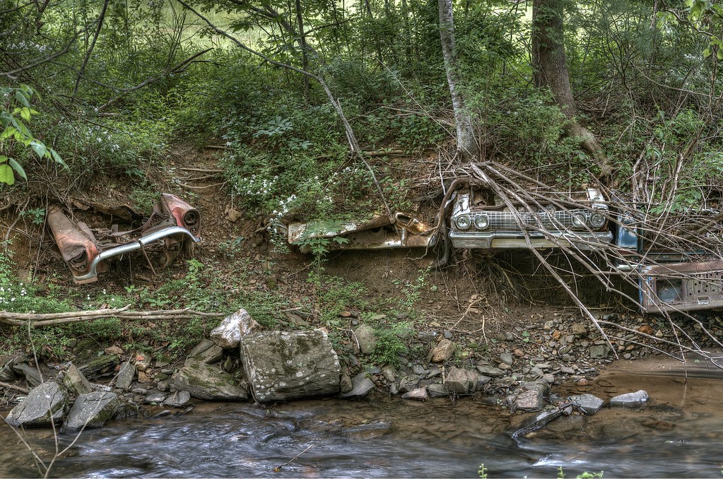Cars in a riverbank A few of many cars imbedded in the Buf… Flickr