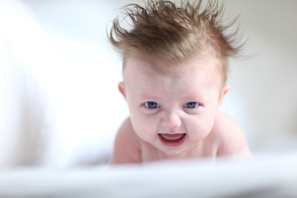 angry baby crying, lying on stomach, tummy time, crawl, ho