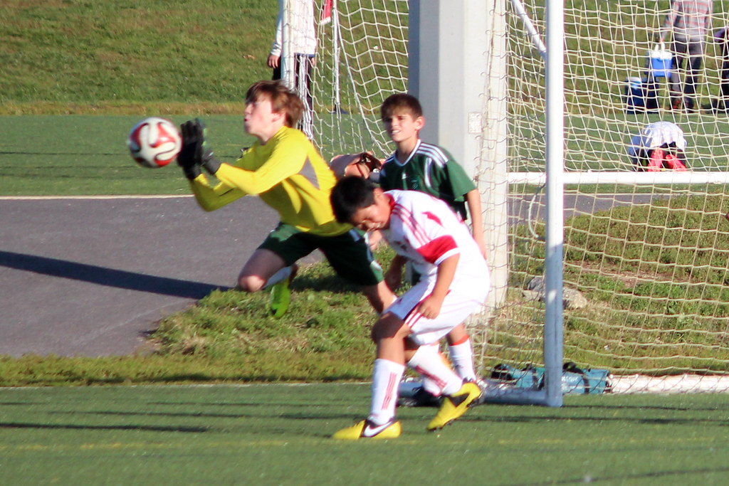 goalie punches out the ball Pics from our sixth game of th… Flickr
