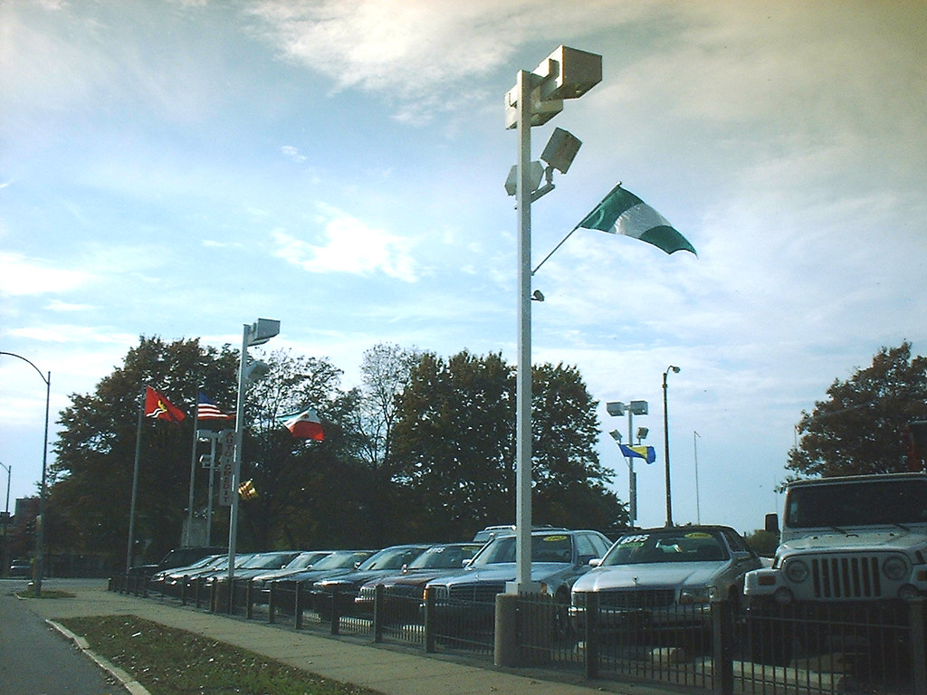 used car lot w flags MBK (Marjie) Flickr