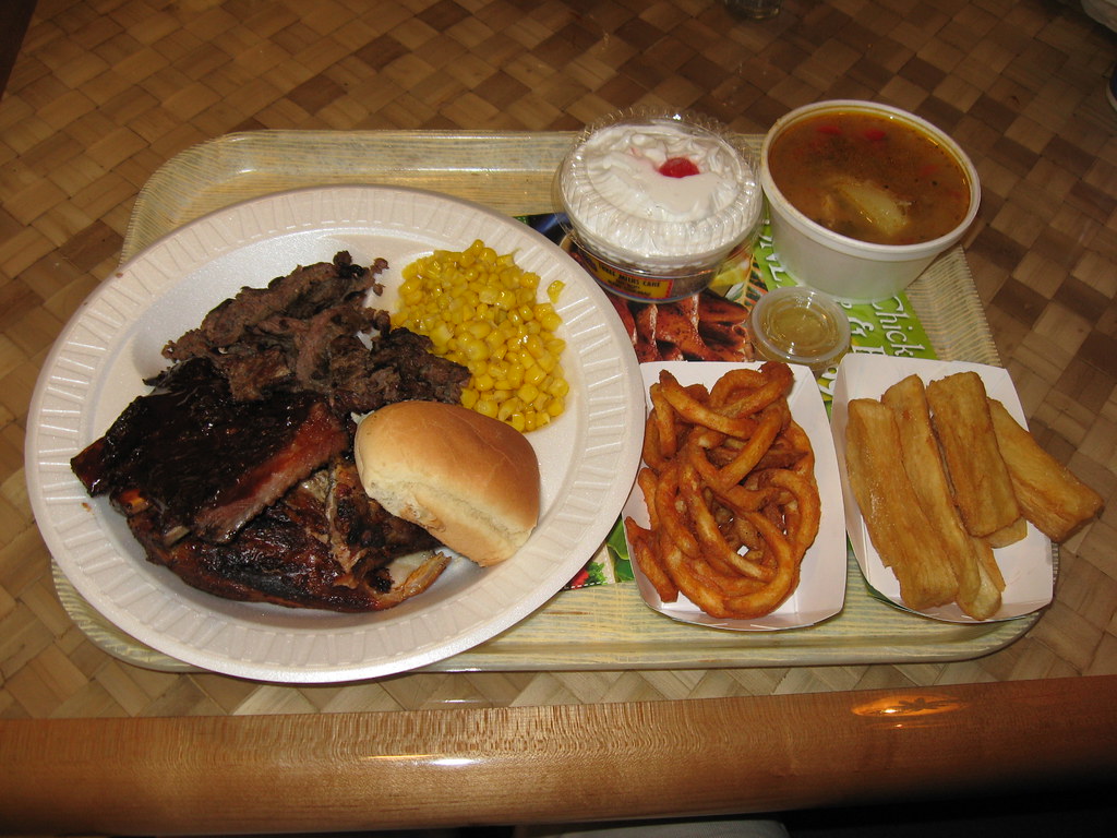 Pollo Tropical Tropical trio, fried yuca, caribbean chicken soup, tres