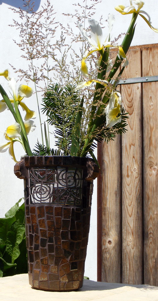 Decor tiles and floor tiles on ceramic vase base Judit Bozsár Flickr