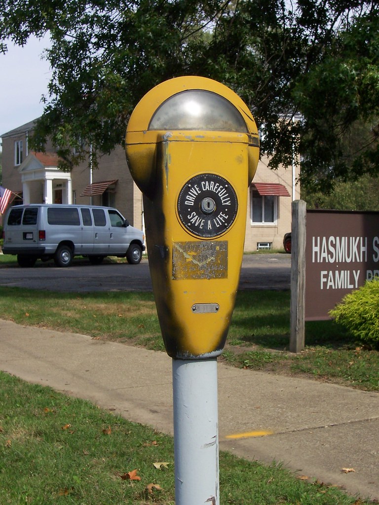 Yellow Parking Meter A sleek yellow parking meter in New P… Flickr