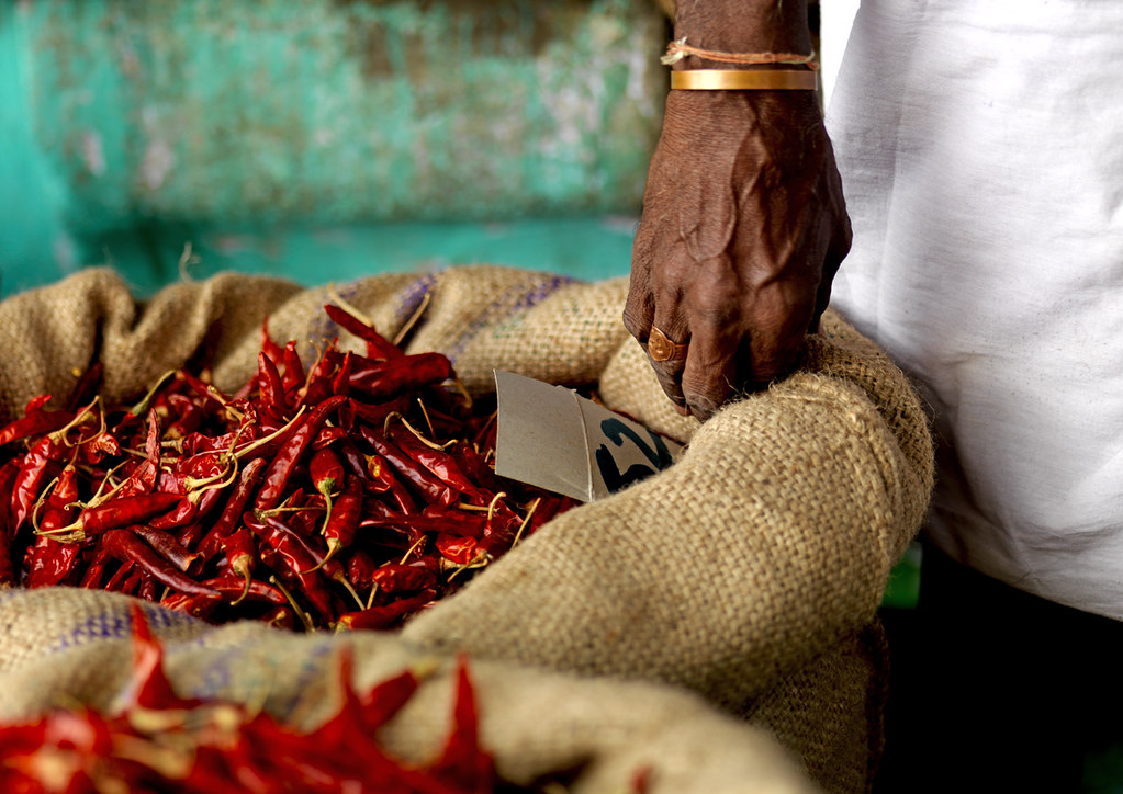Man selling red hot pepper at the market India Madurai I… Flickr