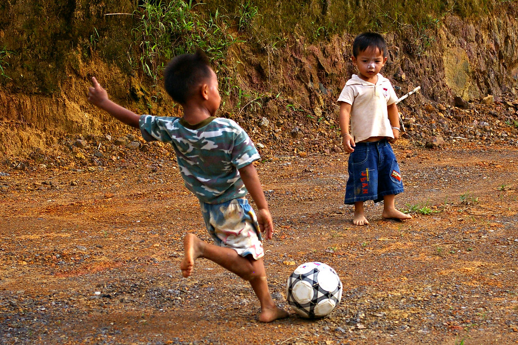 Soccer, Pants Falling Down Khmu boys playing soccer. Flickr