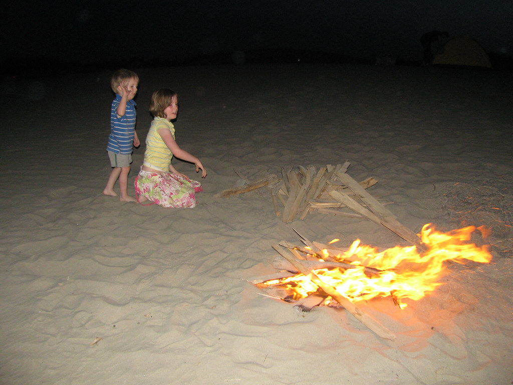 throwing more wood on the fire John Power Flickr