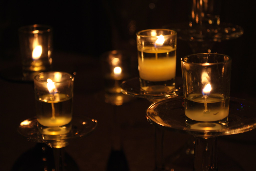 Candlelit Dinner Candles atop wine glasses the center pi… Flickr