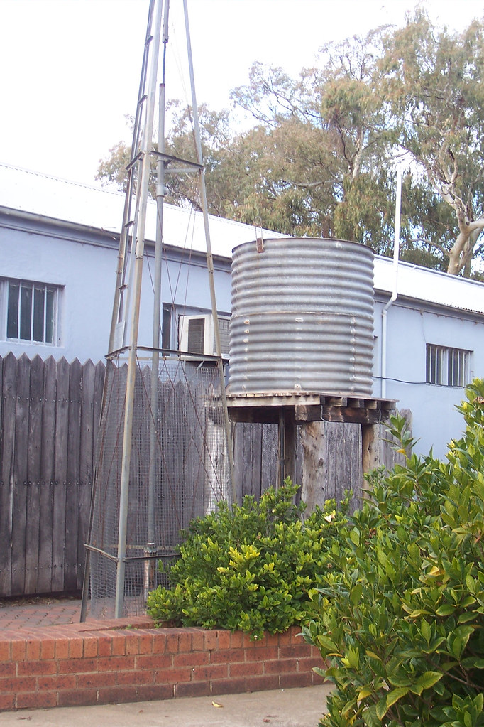 Metal water tank on wooden tank stand The water tank stand… Flickr