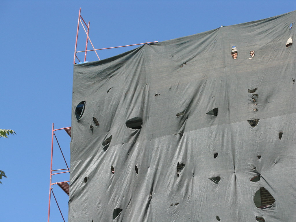 tarp, scaffolding, wind holes julieupmeyer Flickr