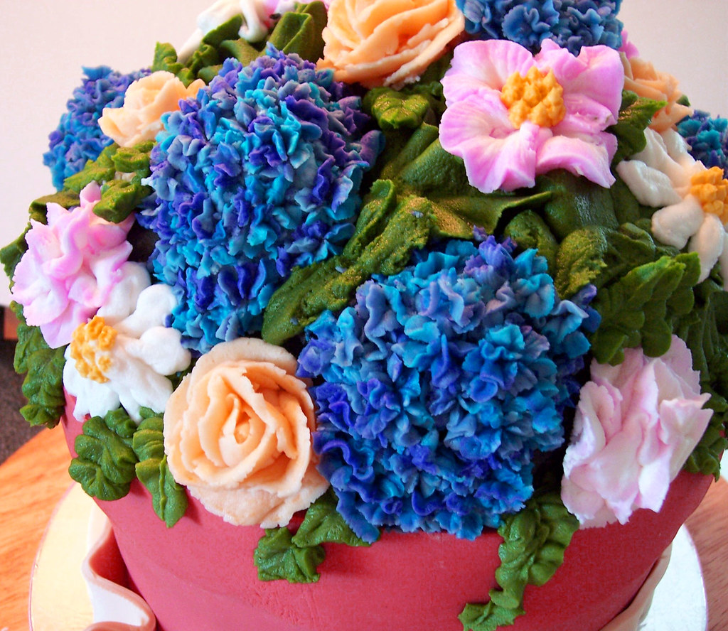 Buttercream flowers BC flowers and fondant clay pot. CakenBake
