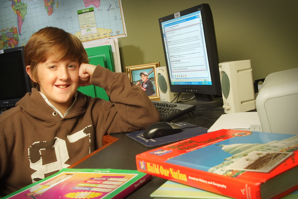 Connections Academy Student with Computer and Textbooks Flickr
