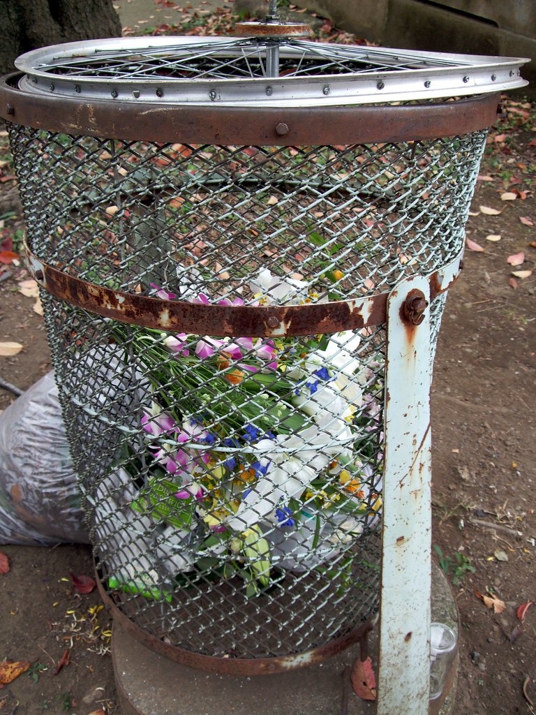 Flowers in the trash at the cemetery Doug Downen Flickr