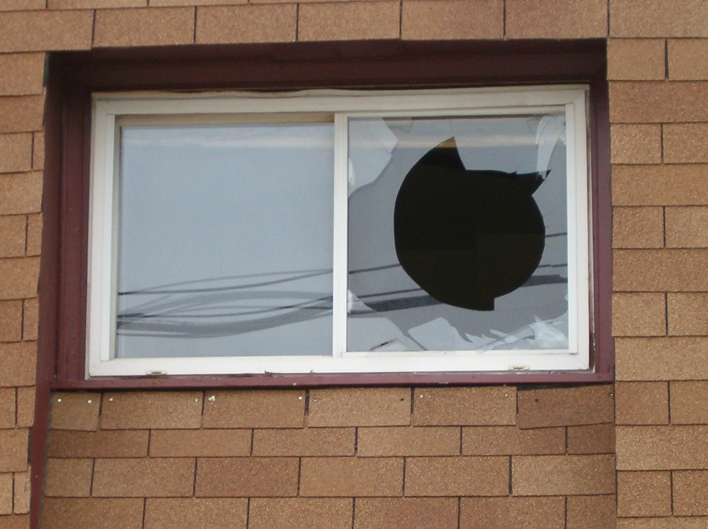 Broken Window Broken window at an apartment complex in Nor… Flickr