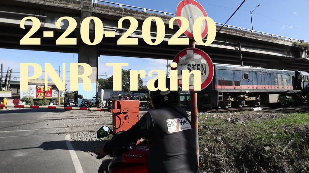 PNR (Philippine National Railways) Train crossing railroad tracks near