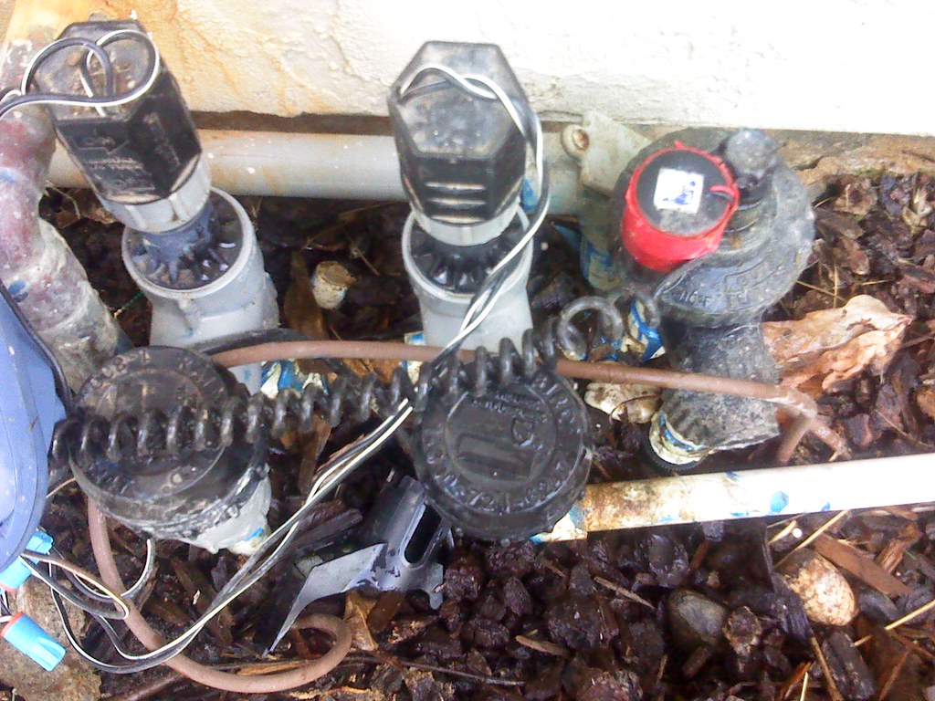 Taking a leak Sprinkler valve is leaking and wasting water… Flickr