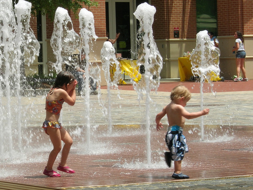Kids playing in the fountain looks like fun... There was… Flickr