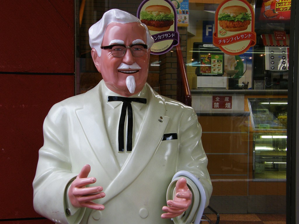 A statue of Colonel Sanders in Ikegami csemege Flickr