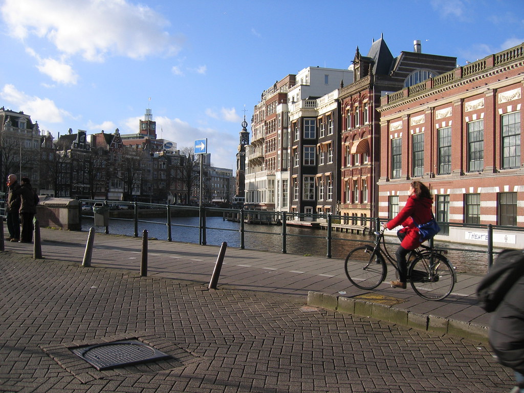 Amsterdam in December Water, cobbles, a girl on a bike. Am… Flickr
