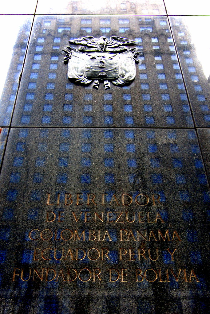 Bolivar Memorial A building reflected on a memorial to Sou… Flickr