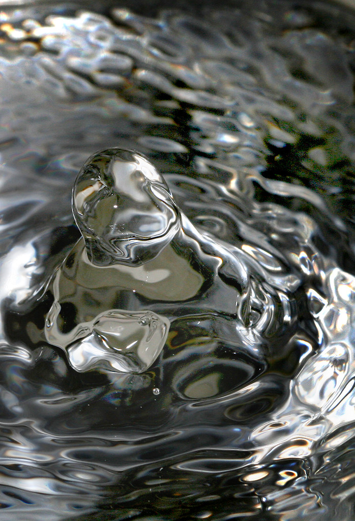 Shimmer Water dropping into a glass Paige Flickr