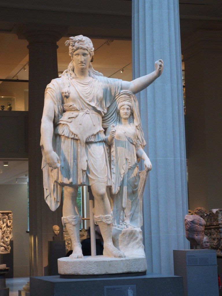 Greek statuesDionysus and a pocketperson Sharron McClellan Flickr