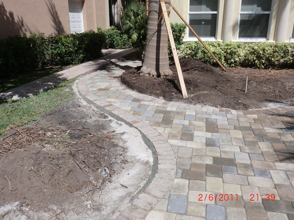 Walkway Long view of walkway on Kaplan's side of home. Quality Cuts