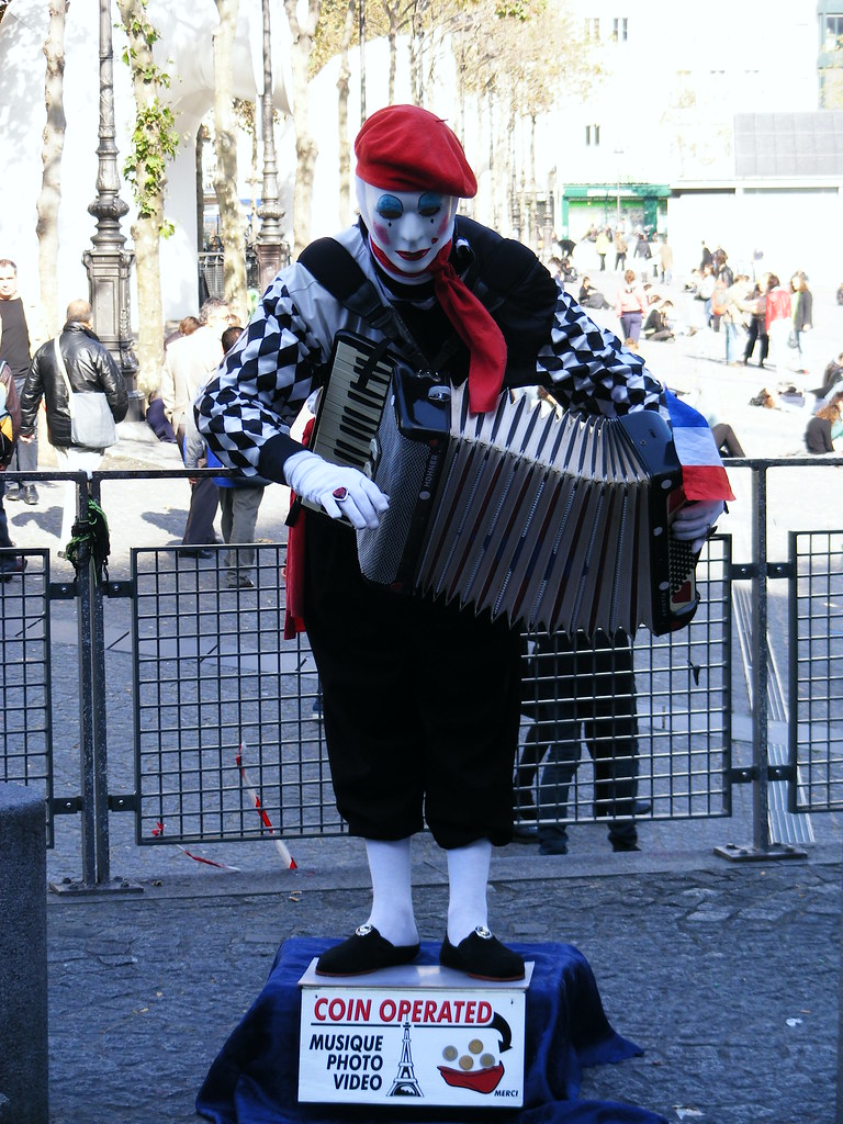 Deeply terrifying mime with accordion, Paris. He is bowing… Flickr