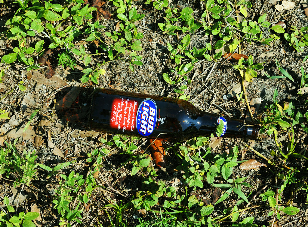 A beer bottle left for me to throw away.... by the thiefs … Flickr