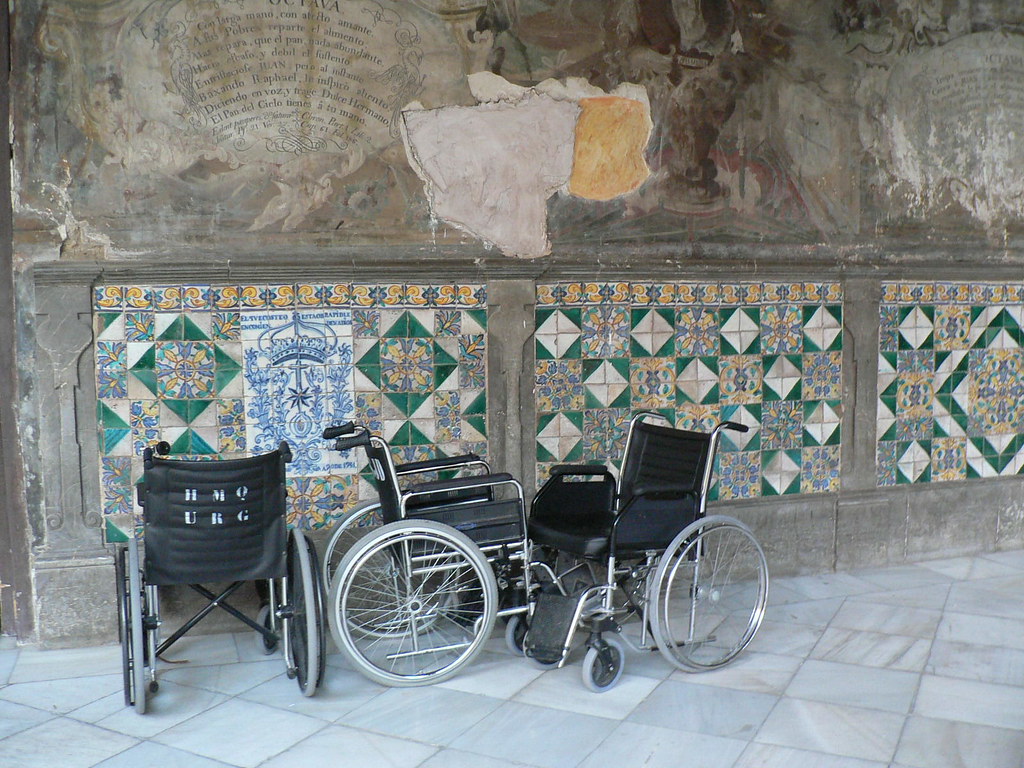 wheelchairs in ancient hospital courtyard Granada, Spain Hertje