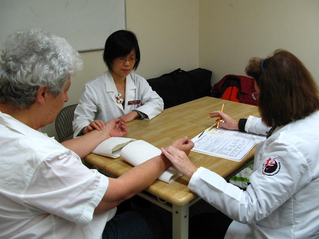 Acupuncture Treatment Doctor Zhao (left) and a senior stud… Flickr