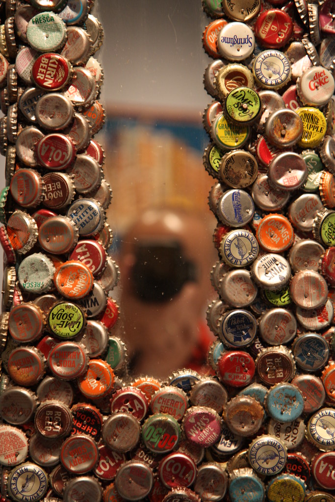 Bottlecap Folk Art Reflection My reflection in a 1960s bot… Flickr