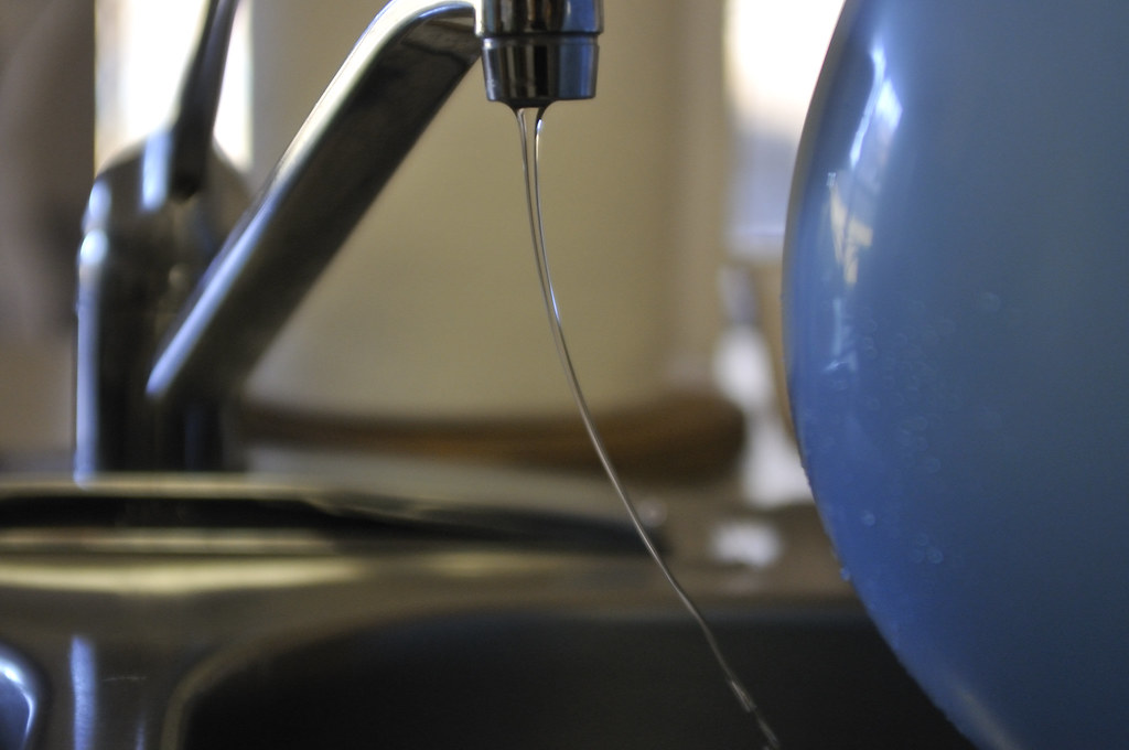 Why Does Water Bend Towards A Balloon