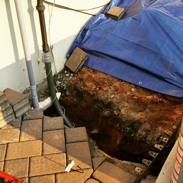 Gas piping and electrical conduit trenched under pavers to… Flickr