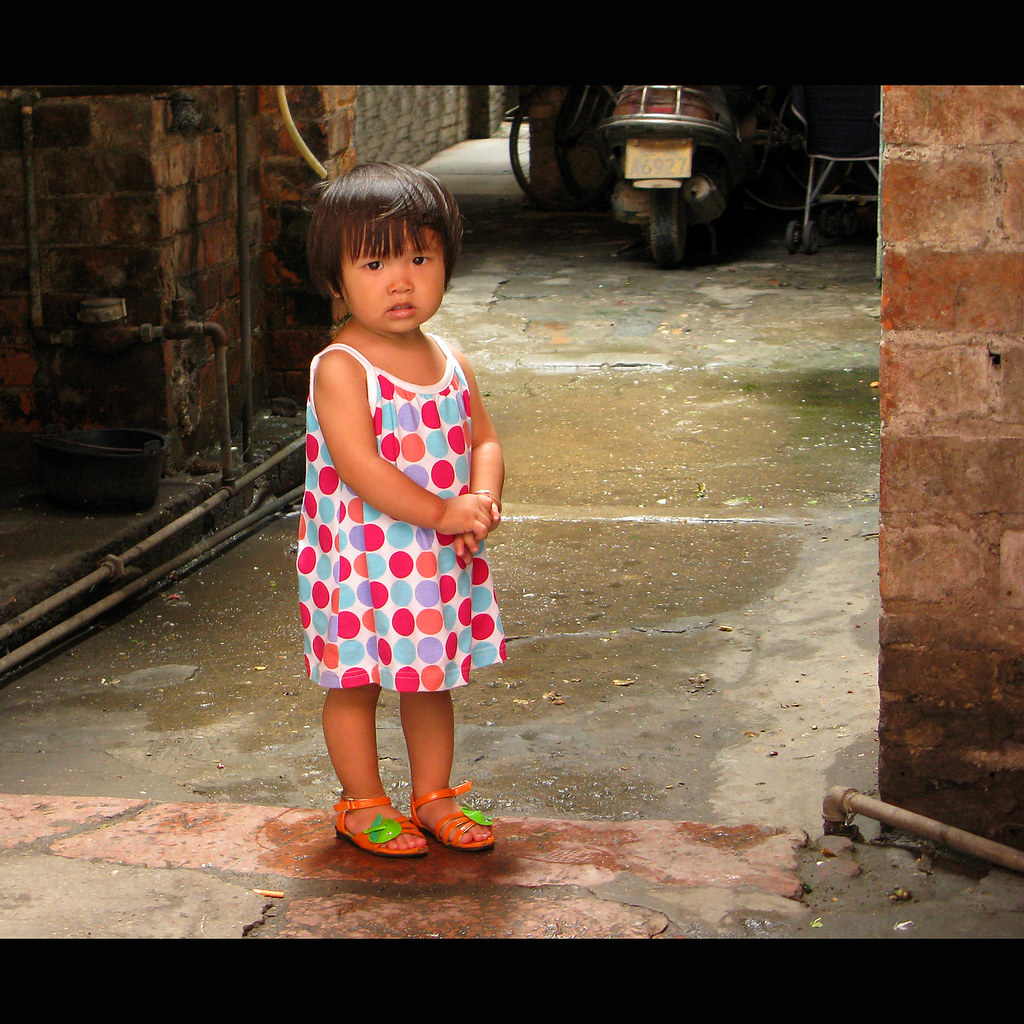 Dots A young girl with a cute dress in one of the