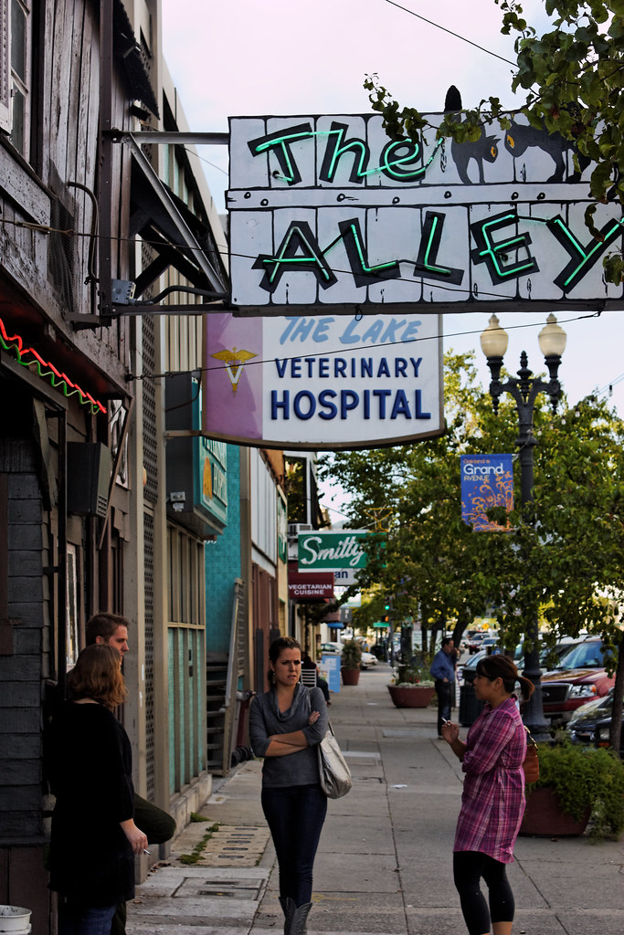 Smokers outside the Alley Bar, Grand Lake District of Oakland a photo
