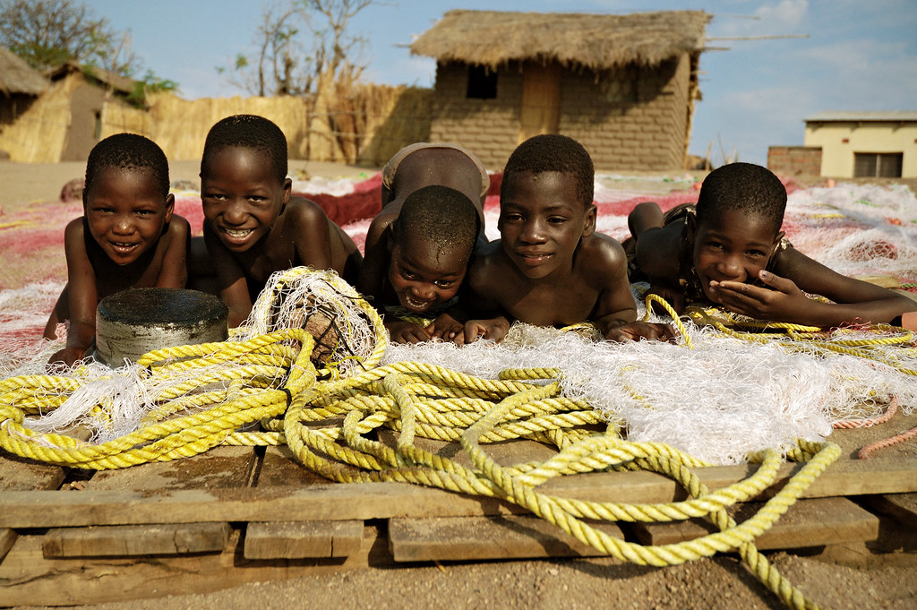 Five african boys having fun and laughing on fishing nets … Flickr