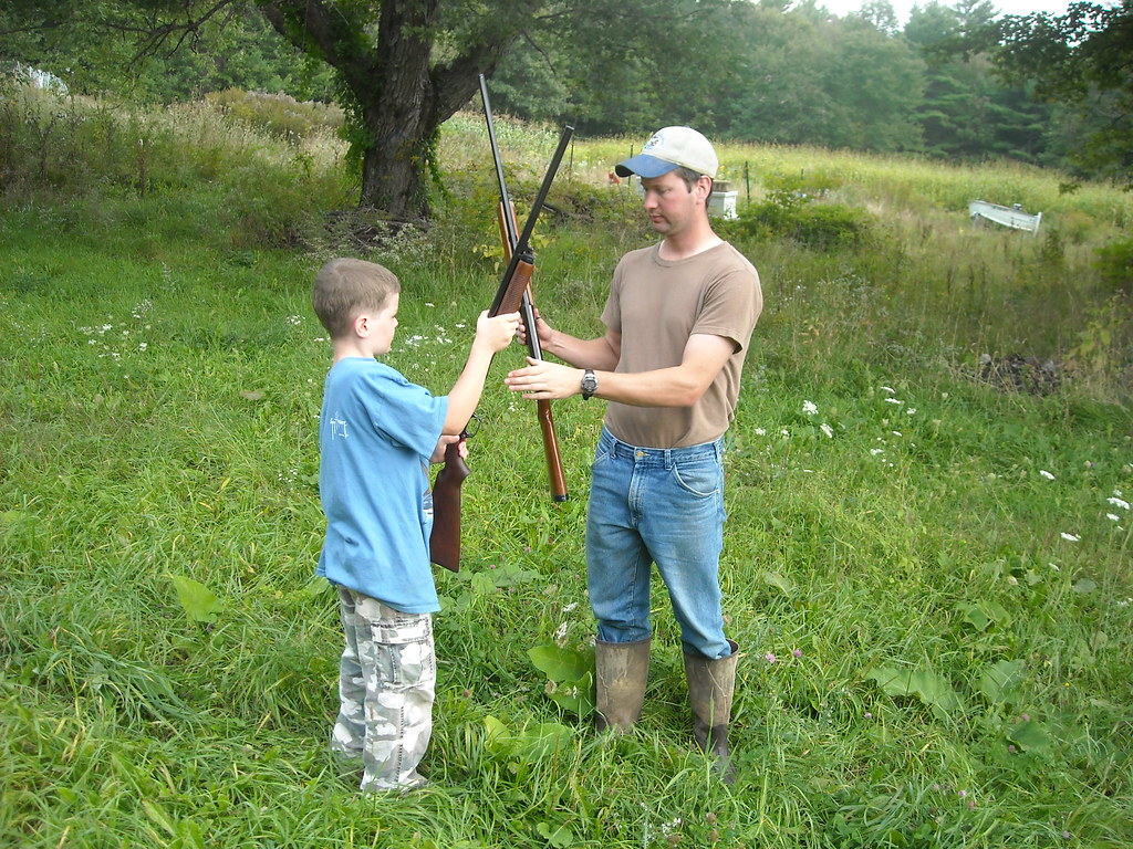 Hunter Safety Tom is showing Keaton "the basics" of firear… Flickr