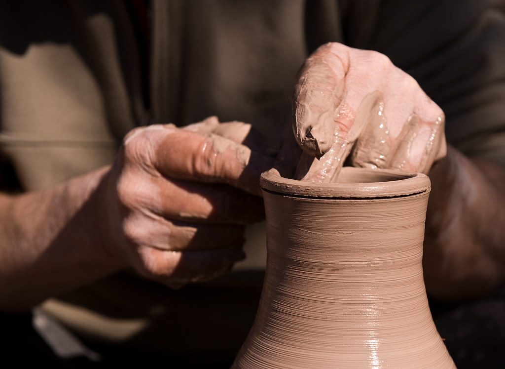 Hands at Work Artist's hands hard at work crafting a vase.… Flickr