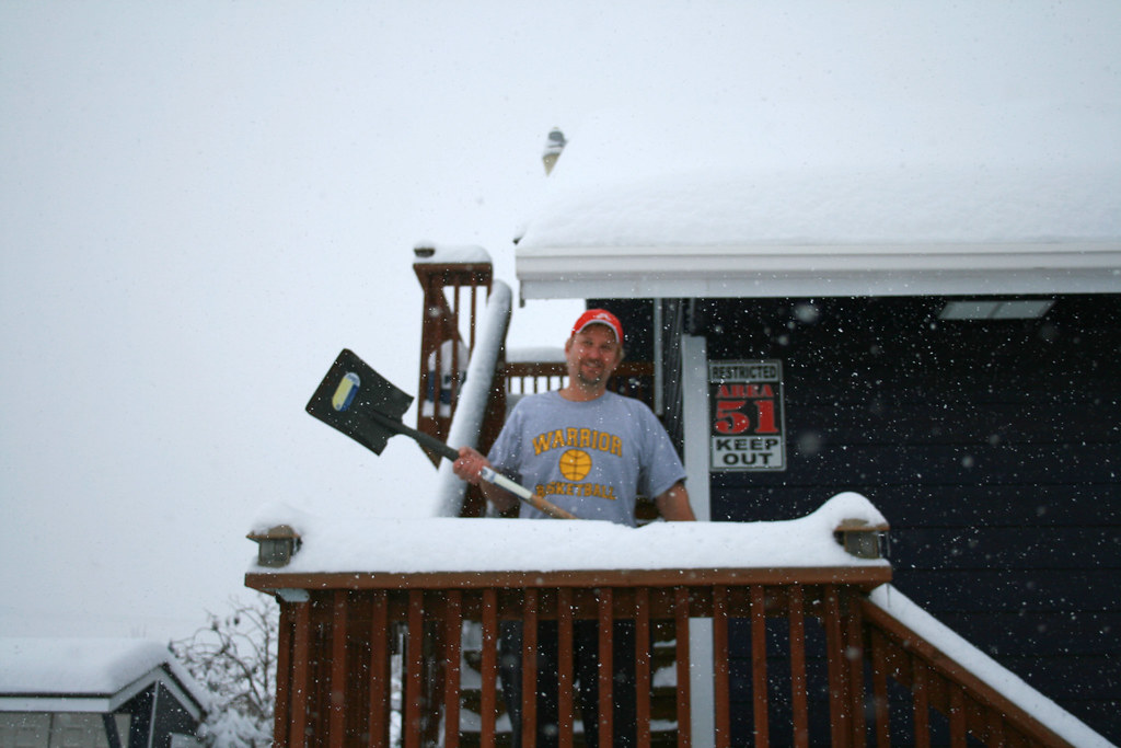 snowshoveler Shoveling snow during the storm. wallawallarealestate