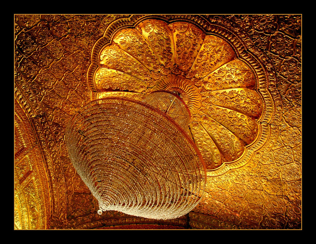 CHANDELIER Chandelier and gold work on the wallsGolden Te… Flickr