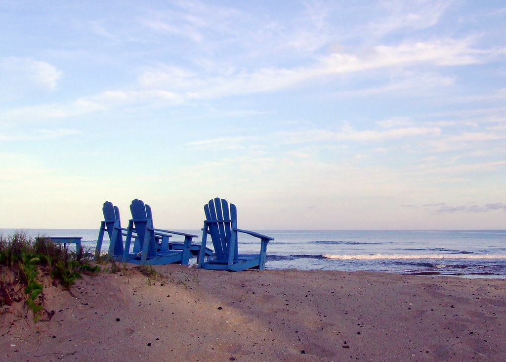 Beach Chair Trio Shot during low tide, early morning at th… Flickr