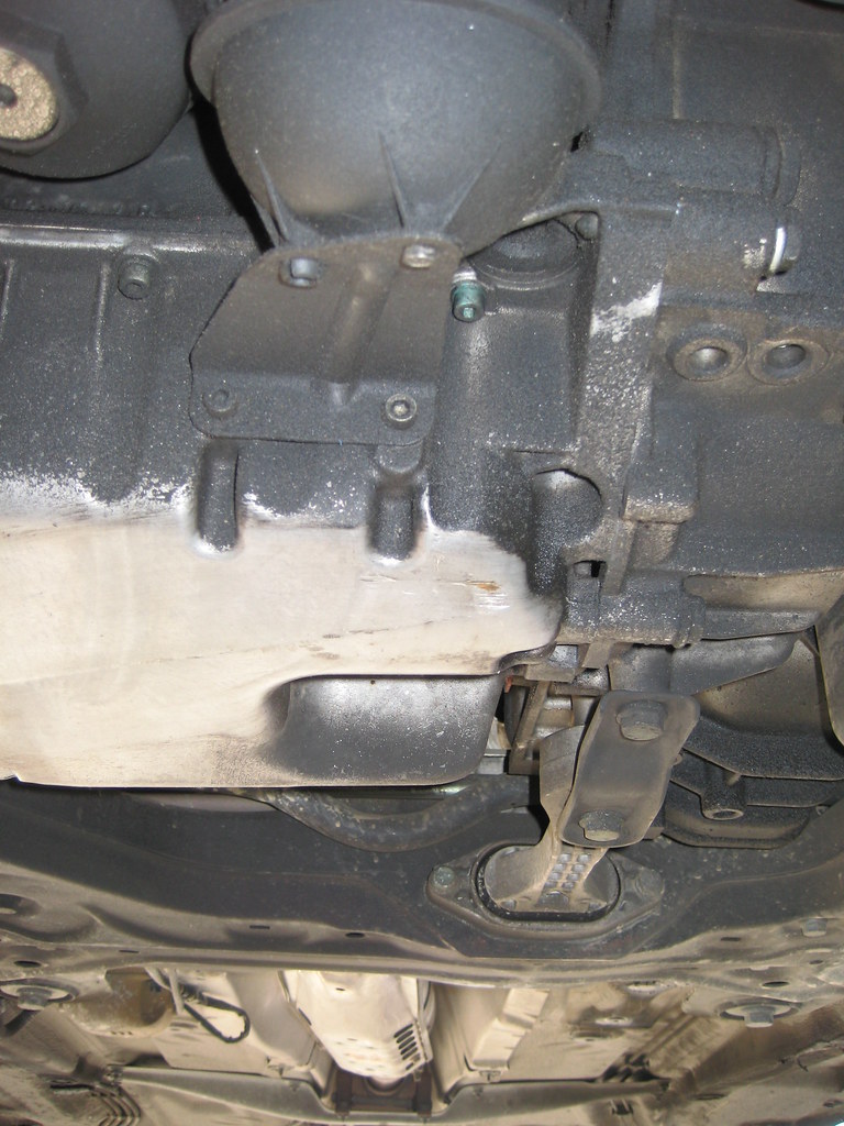 Oli Pan Damage 011 Oil pan damage from underneath the car