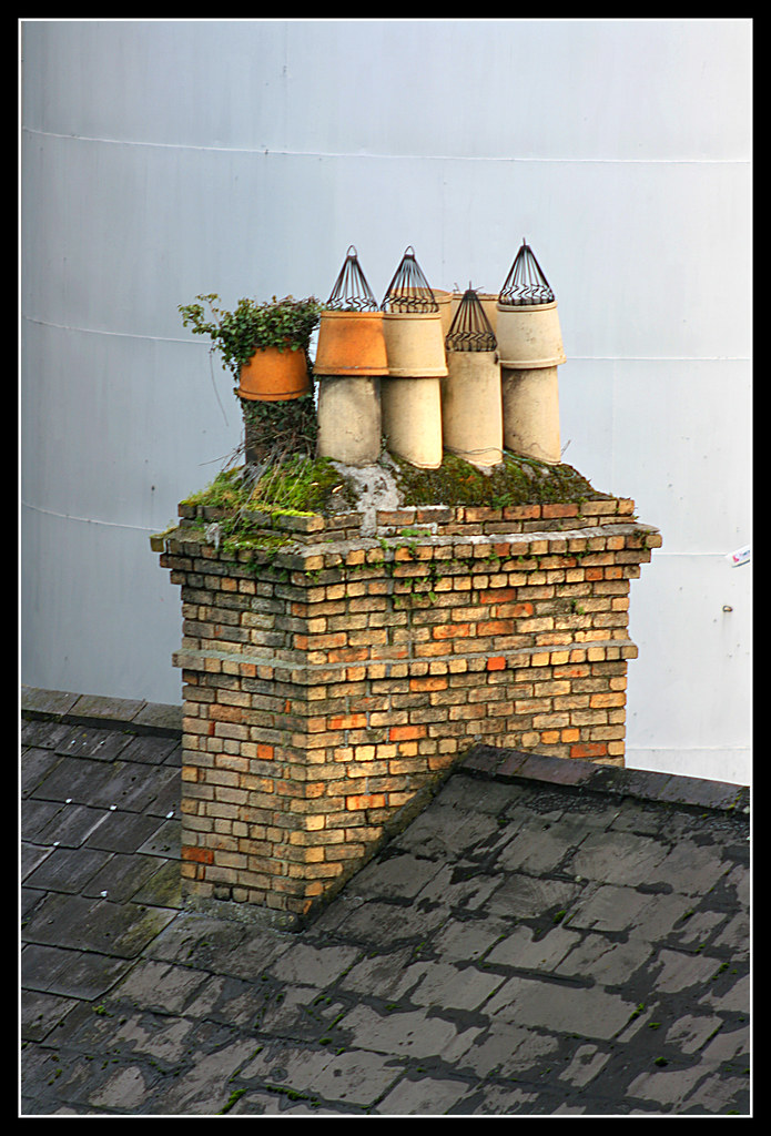 Chimney Pots A set of chimney pots, caps and plants on a r… Flickr