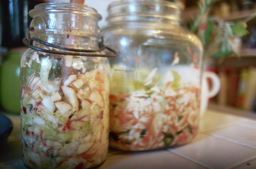 sauerkraut and kimchi, in jars the kimchi was thoroughly a… Flickr