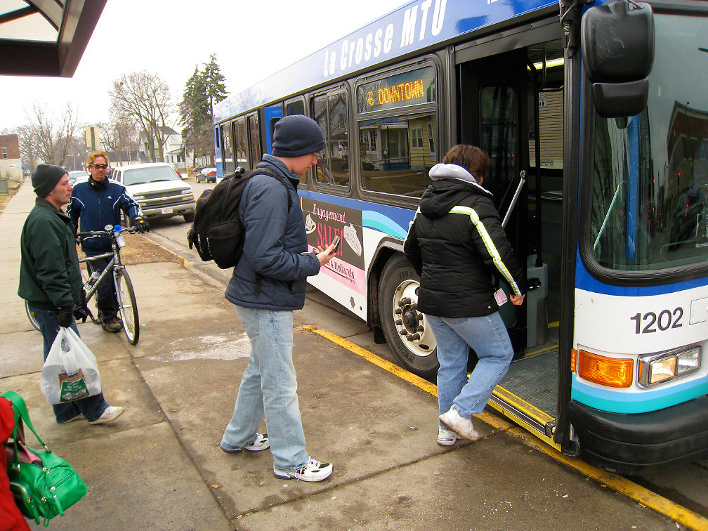 Heading Downtown Passengers board a city bus in La Crosse,… Flickr