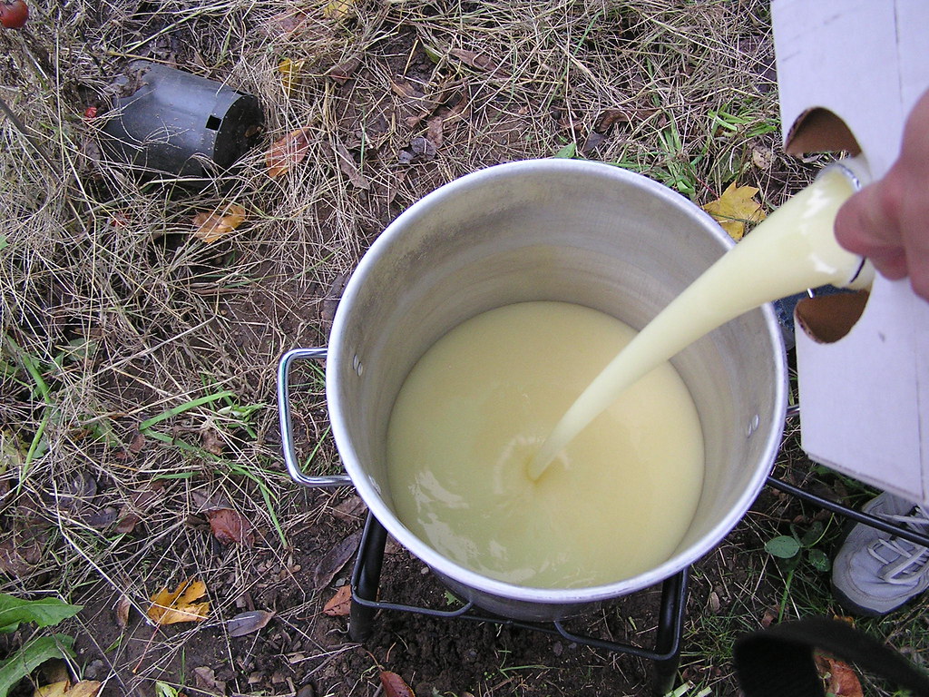 The Pouring Of The Trans Fats Costco deep fryer oil. Propa… Flickr