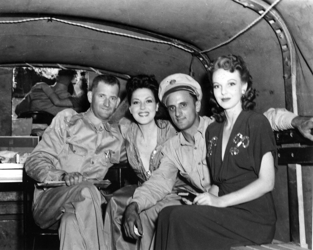 USO entertainers in the back of a military vehicle during World War II