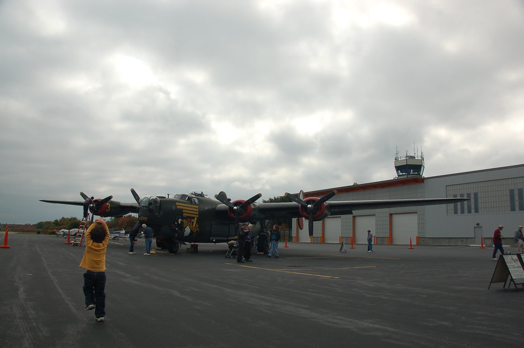 Isaac running toward the B25 with the Norwood Airport con… Flickr