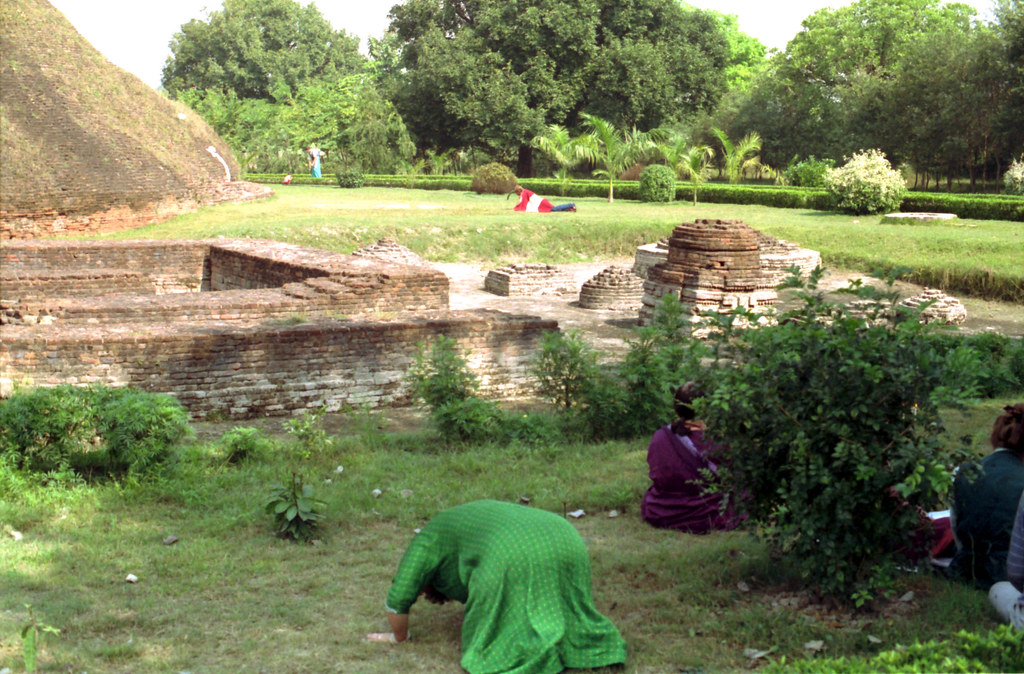 Buddhists prostrating at Buddha's cremation stupa, histori… Flickr