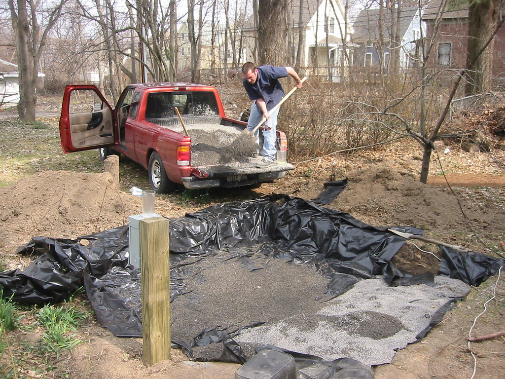 hot tub installation continues Nate shoveling gravel into … Flickr